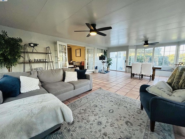 tiled living room with ceiling fan