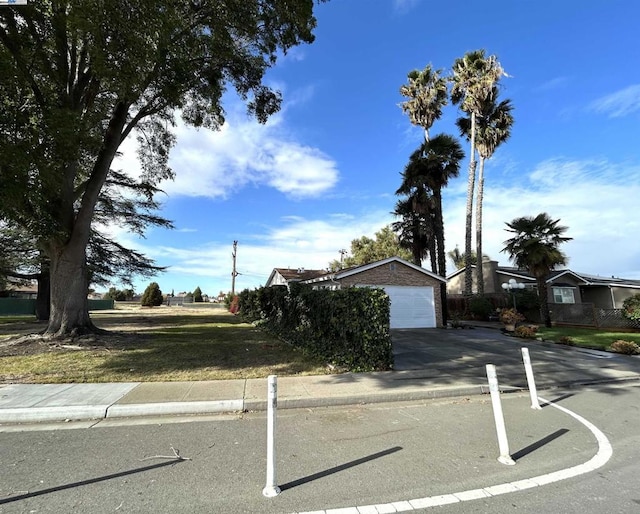 obstructed view of property featuring a garage