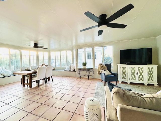 sunroom featuring a wealth of natural light and ceiling fan