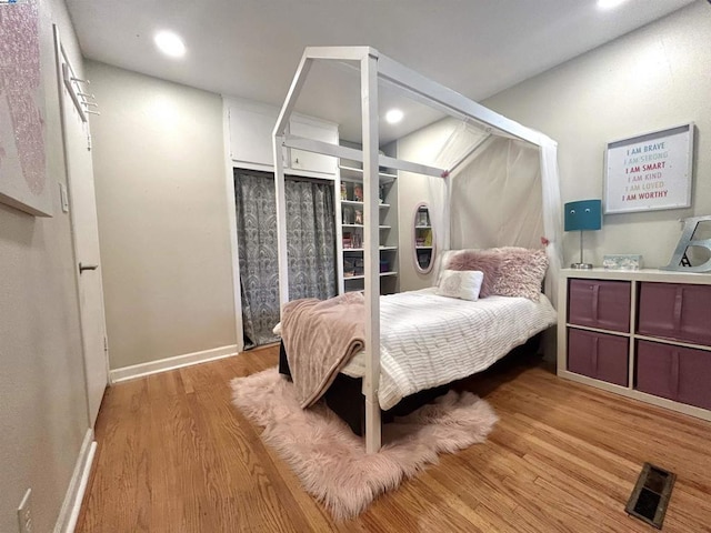 bedroom featuring light wood-type flooring