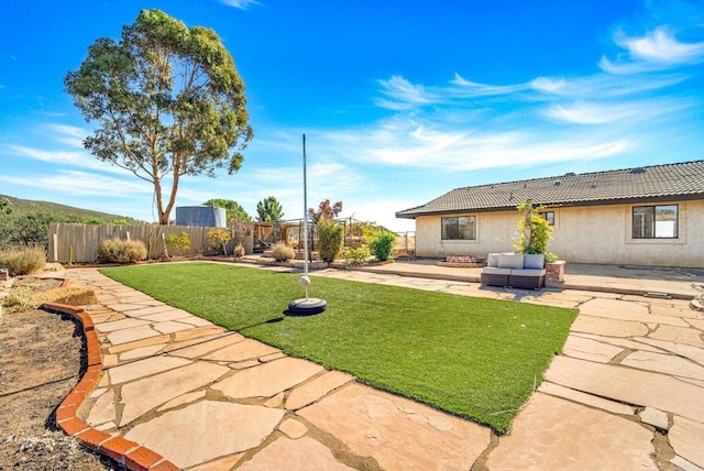 view of yard with an outdoor hangout area and a patio