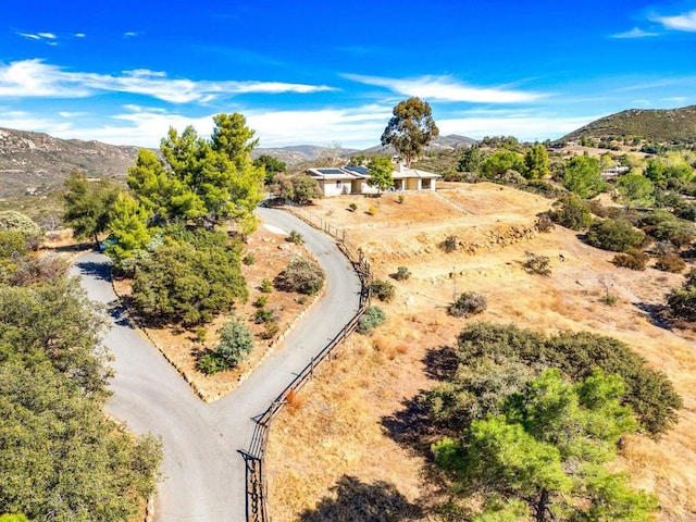 birds eye view of property featuring a mountain view