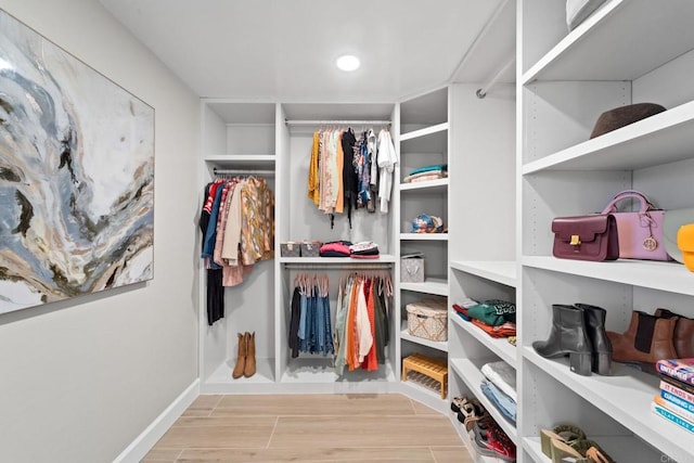 spacious closet featuring light hardwood / wood-style floors