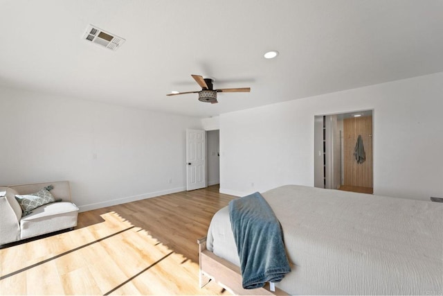 bedroom featuring wood-type flooring and ceiling fan