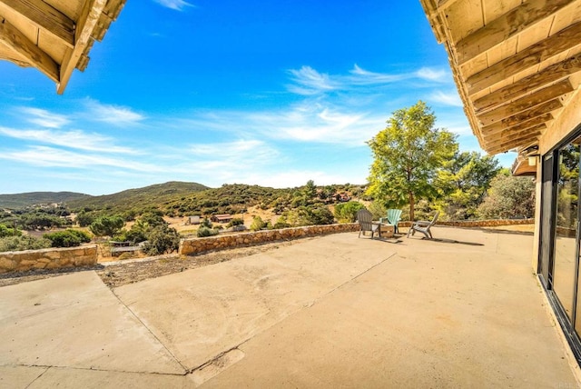 view of patio / terrace featuring a mountain view