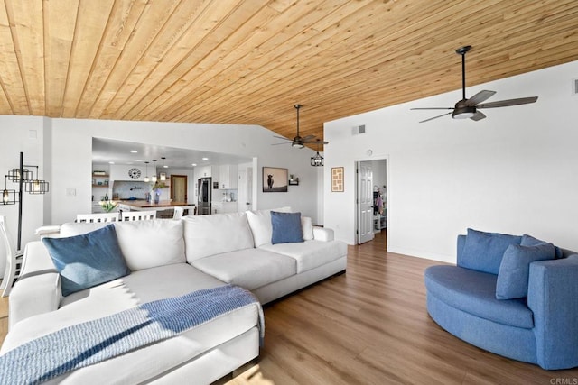 living room featuring hardwood / wood-style floors, ceiling fan, lofted ceiling, and wooden ceiling