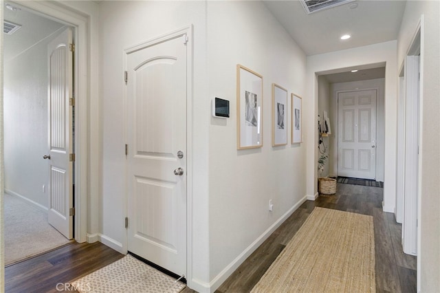 corridor featuring dark hardwood / wood-style flooring