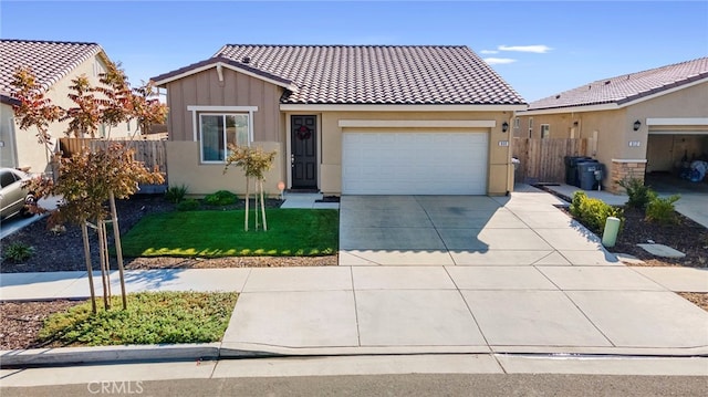 view of front facade with a front yard and a garage