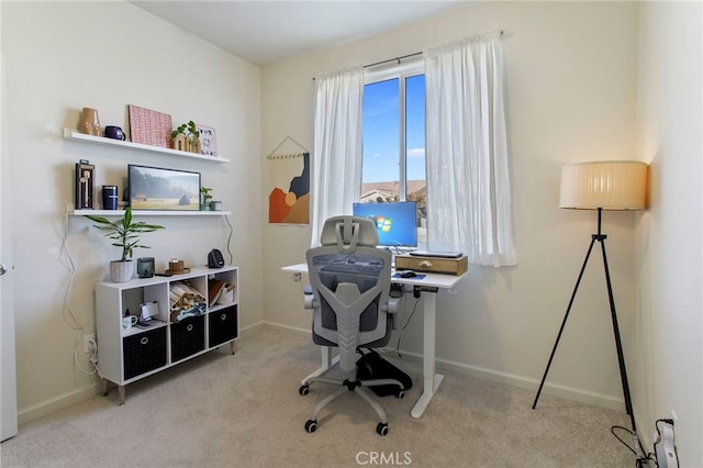 office area featuring light colored carpet