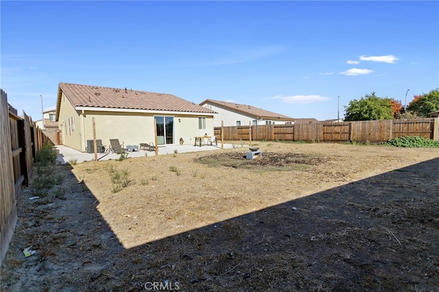 back of house featuring cooling unit