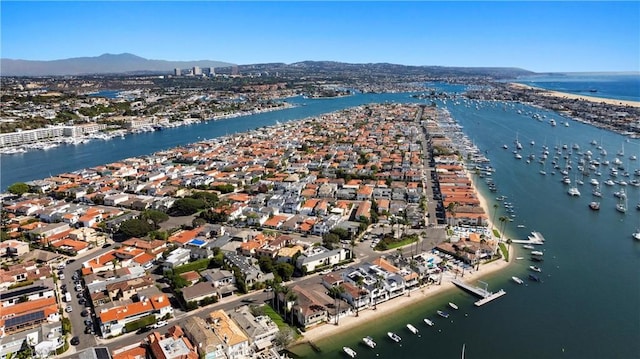 aerial view featuring a water and mountain view