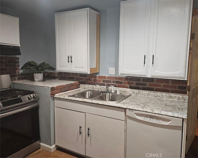 kitchen featuring sink, white cabinets, and appliances with stainless steel finishes