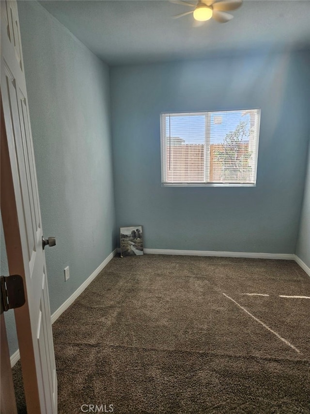 spare room with carpet flooring and ceiling fan