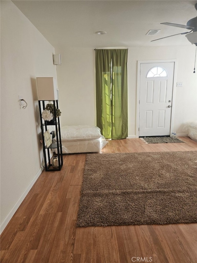 entrance foyer with ceiling fan and dark hardwood / wood-style floors