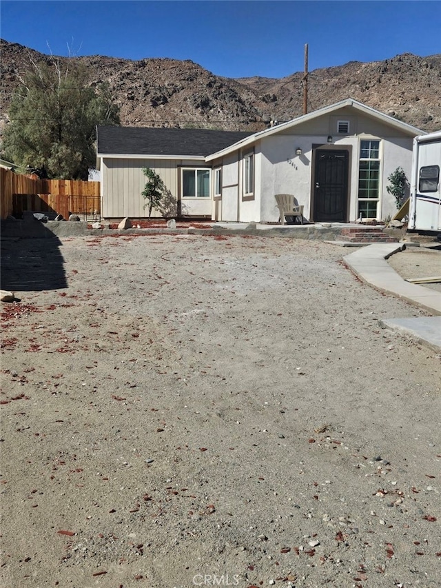 view of front of home featuring a mountain view