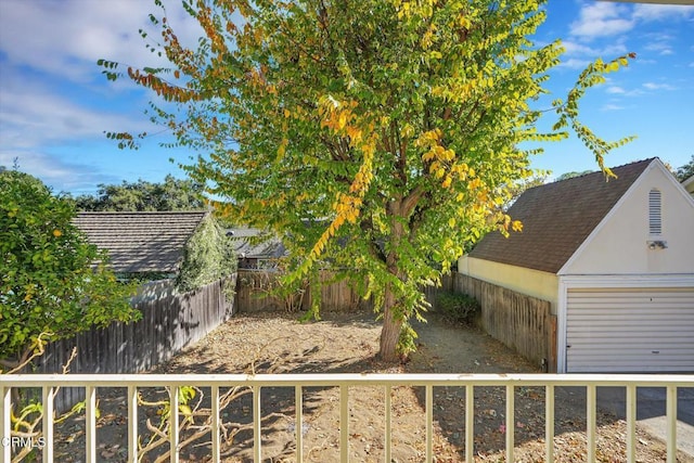 view of yard featuring an outbuilding and a garage