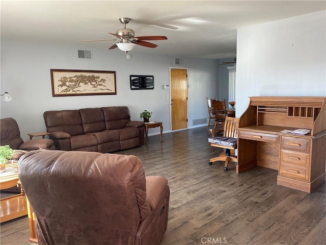 living room featuring ceiling fan and dark wood-type flooring