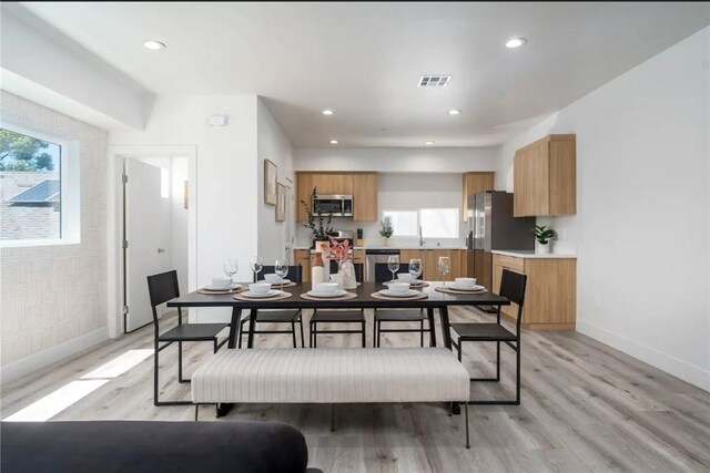 dining space featuring light hardwood / wood-style flooring