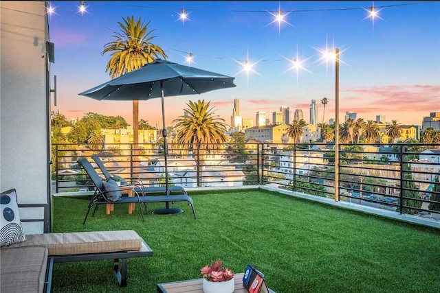 yard at dusk with a balcony