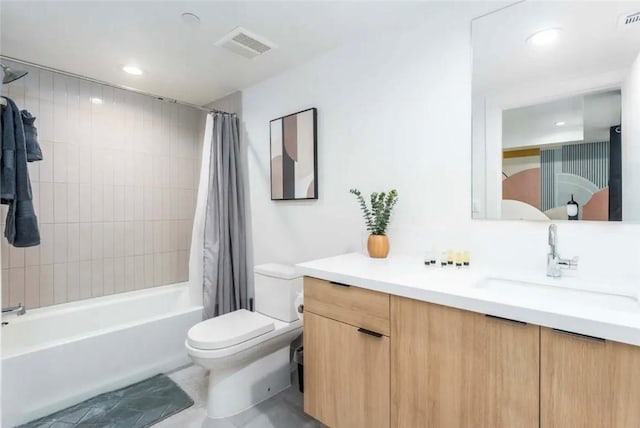 full bathroom with shower / bath combination with curtain, toilet, and vanity