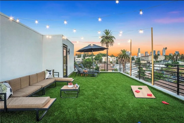 exterior space with outdoor lounge area and a balcony