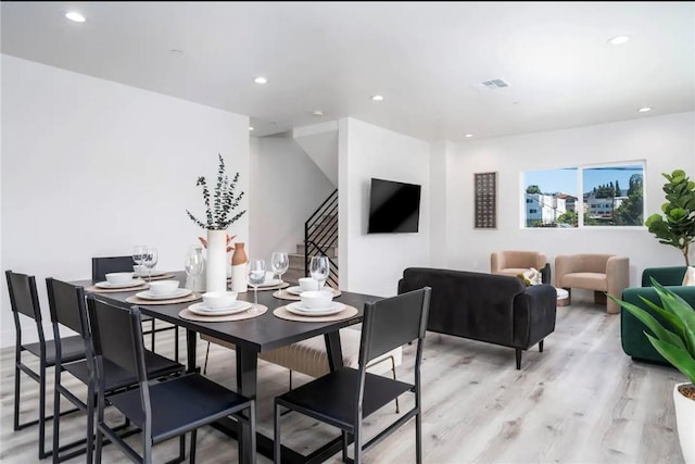 dining room featuring light hardwood / wood-style flooring