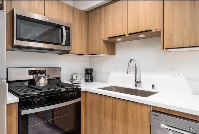 kitchen featuring appliances with stainless steel finishes and sink