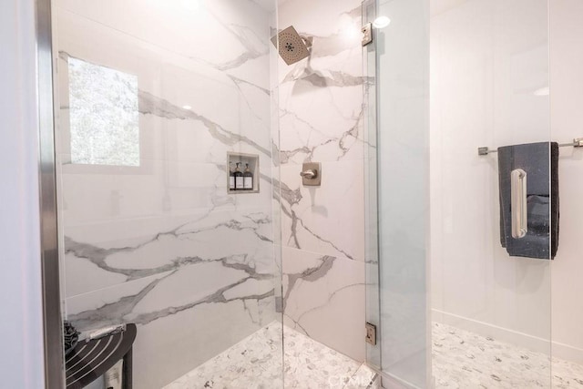 bathroom with a shower with shower door