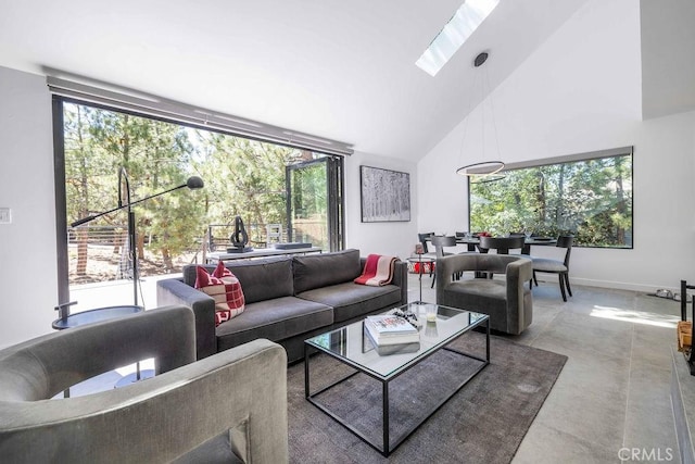 living room featuring high vaulted ceiling and a wealth of natural light