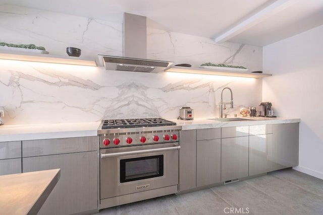 kitchen with gray cabinetry, sink, premium range, backsplash, and island range hood