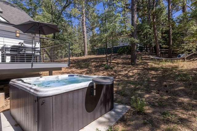 view of yard featuring a hot tub and a deck