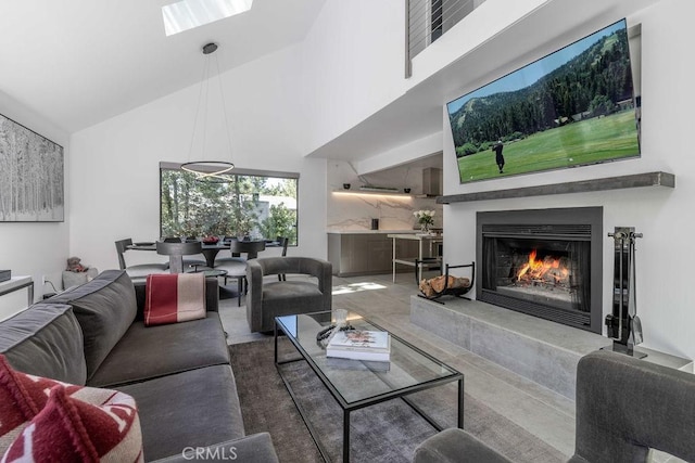 living room with high vaulted ceiling