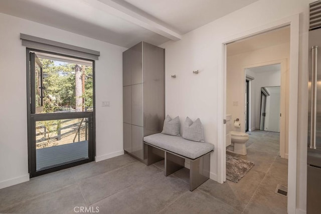 mudroom featuring beam ceiling