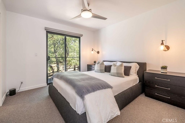 bedroom with access to outside, ceiling fan, and light colored carpet