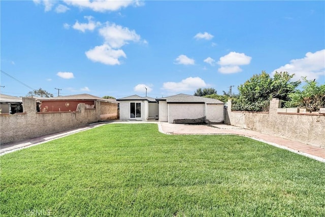 rear view of property with a lawn