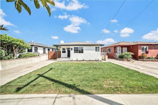 single story home with a front yard