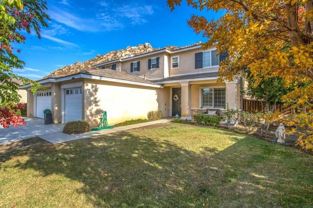 view of front of home featuring a front yard and a garage