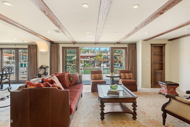 living room with beam ceiling and french doors