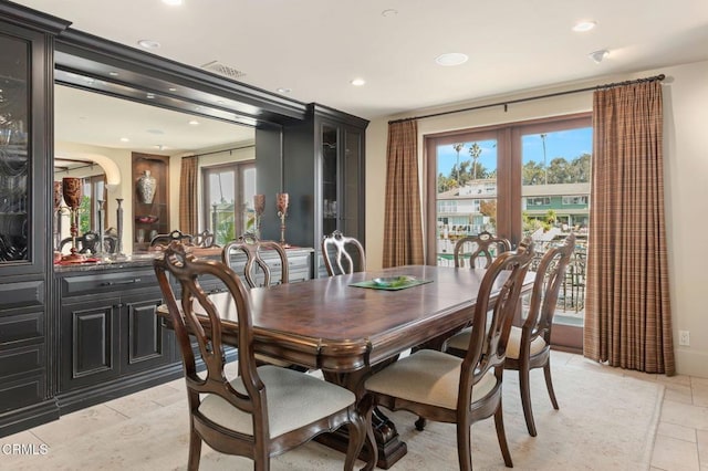 dining room with plenty of natural light and french doors