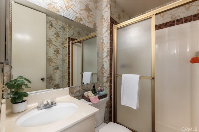 6542 Ocean Crest Dr Unit C-309, Rancho Palos Verdes, CA 90275 - bathroom featuring wallpapered walls, a stall shower, and vanity