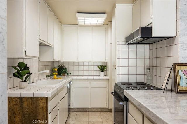 6542 Ocean Crest Dr Unit C-309, Rancho Palos Verdes, CA 90275 - kitchen featuring electric stove, decorative backsplash, tile countertops, range hood, and white cabinets