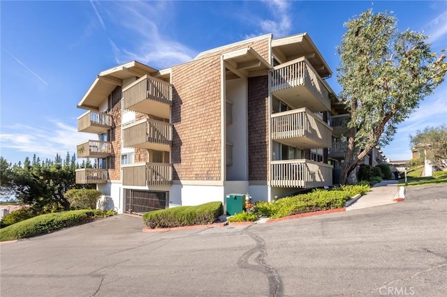 6542 Ocean Crest Dr Unit C-309, Rancho Palos Verdes, CA 90275 - view of apartment building / complex featuring an attached garage and driveway