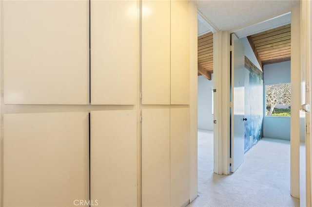 6542 Ocean Crest Dr Unit C-309, Rancho Palos Verdes, CA 90275 - corridor featuring light colored carpet and beamed ceiling