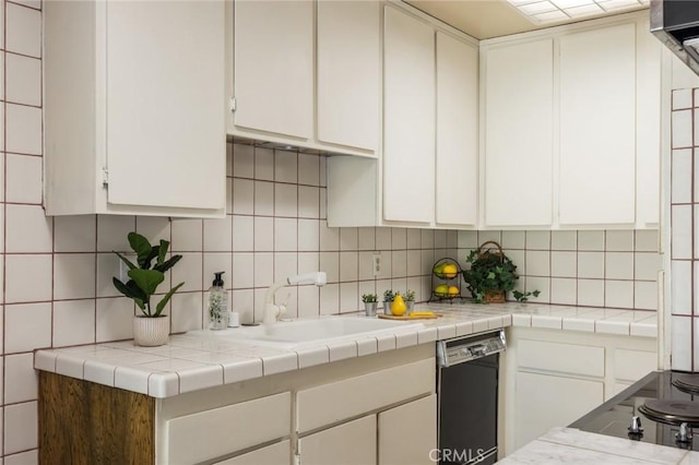 6542 Ocean Crest Dr Unit C-309, Rancho Palos Verdes, CA 90275 - kitchen with black appliances, white cabinetry, and decorative backsplash