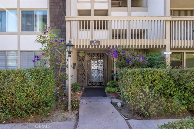 doorway to property featuring a balcony