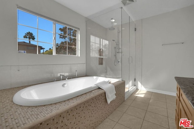 bathroom featuring vanity, separate shower and tub, and tile patterned floors