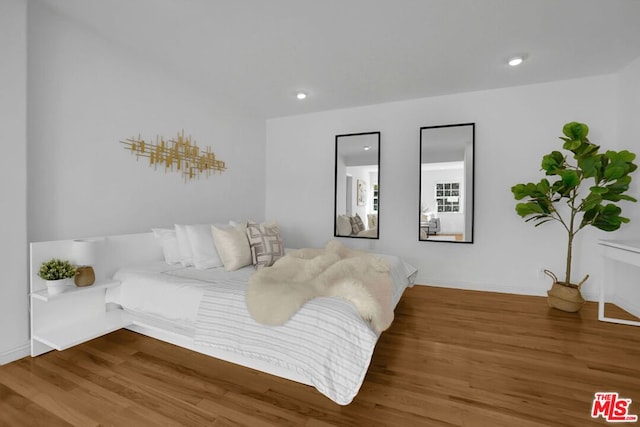 bedroom featuring wood-type flooring