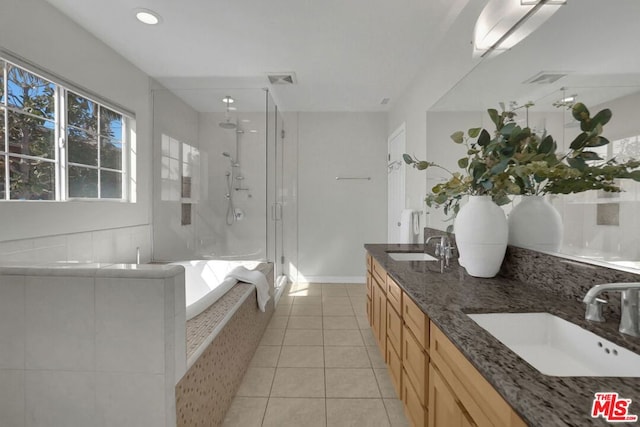 bathroom with tile patterned flooring, vanity, and independent shower and bath