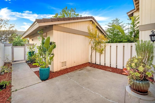 view of side of property featuring a patio