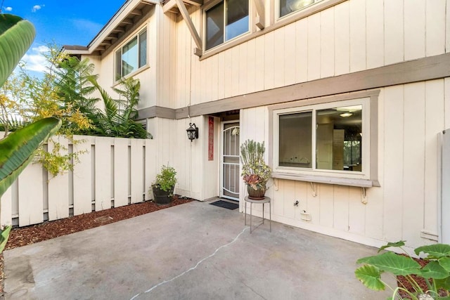 entrance to property with a patio